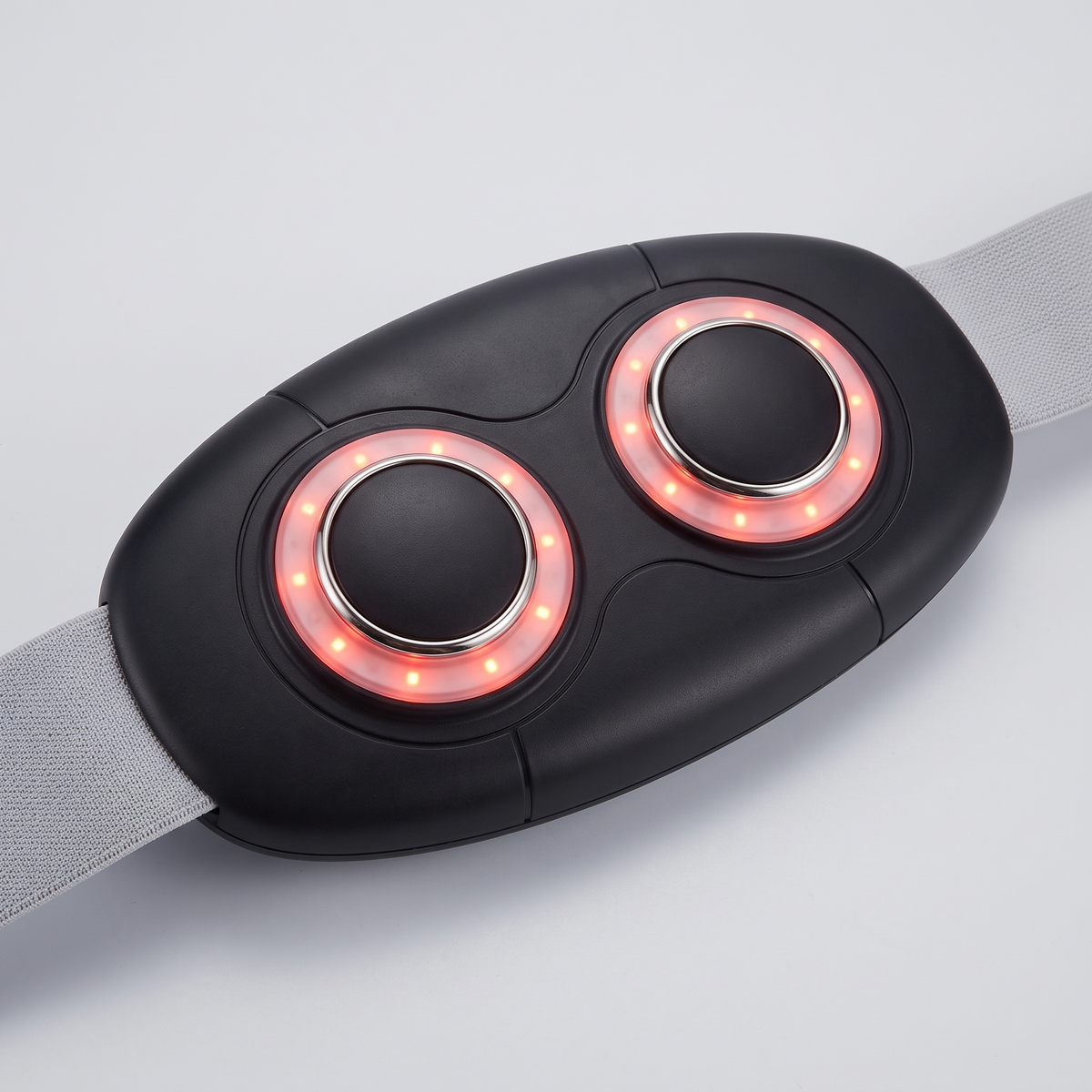 Face interne de la ceinture massante 3-en-1 : deux têtes chauffantes et vibrantes à lumière infrarouge