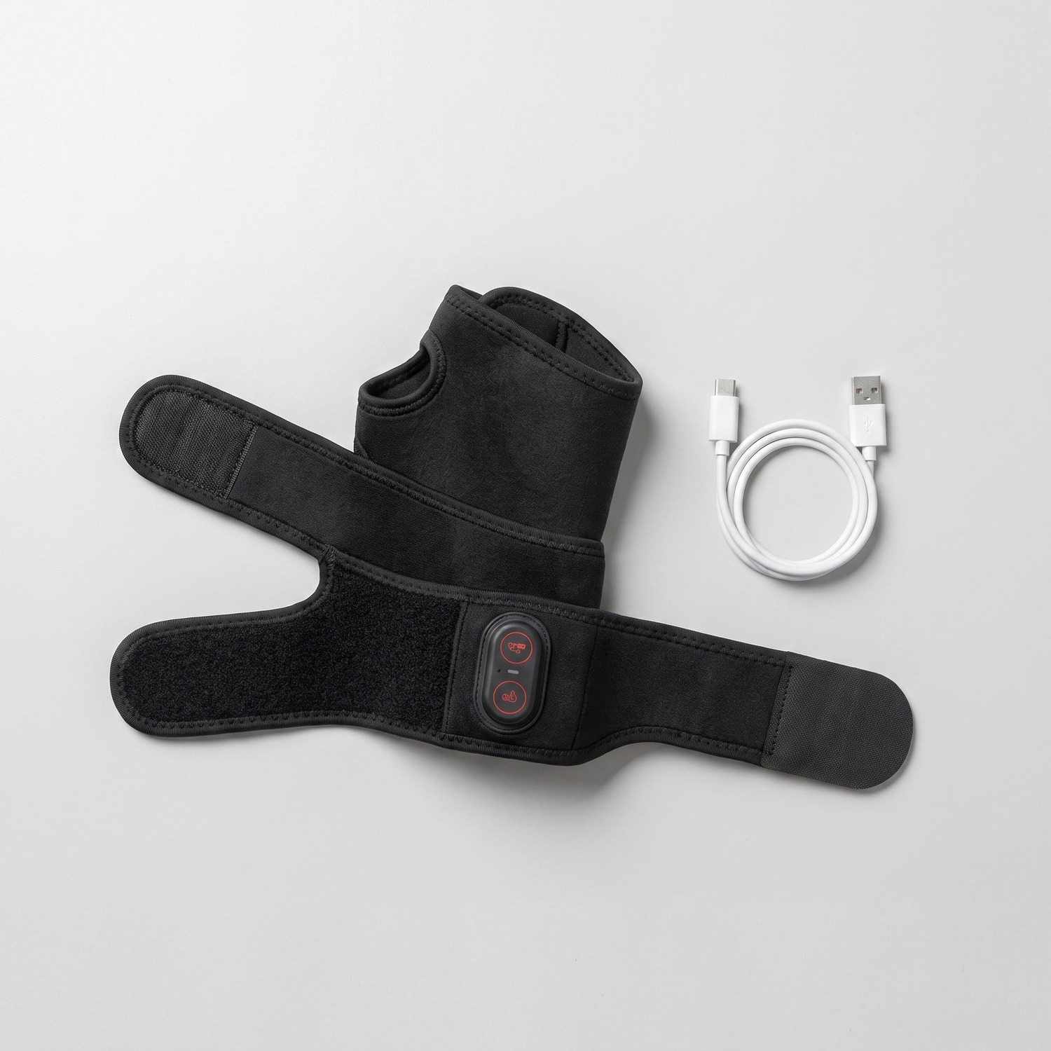 Attelle chauffante poignet infrarouge à plat, sangles ouvertes, avec câble de recharge