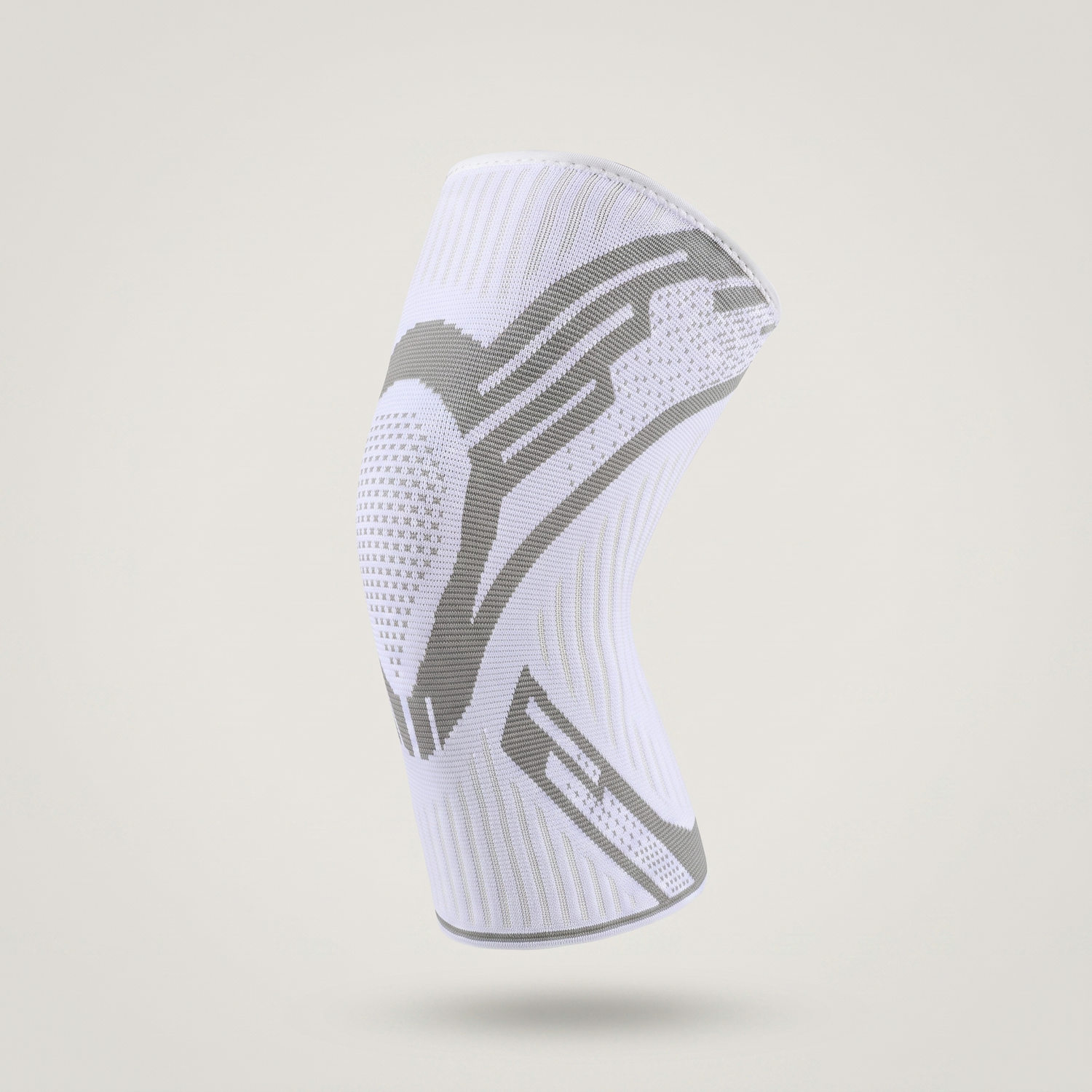 Manchon de genou compression Le Sport Français, coloris blanc, vue trois quarts sur fond clair