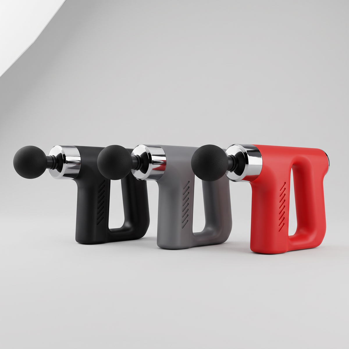 Mini pistolet de massage disponible en trois coloris : noir, gris et rouge