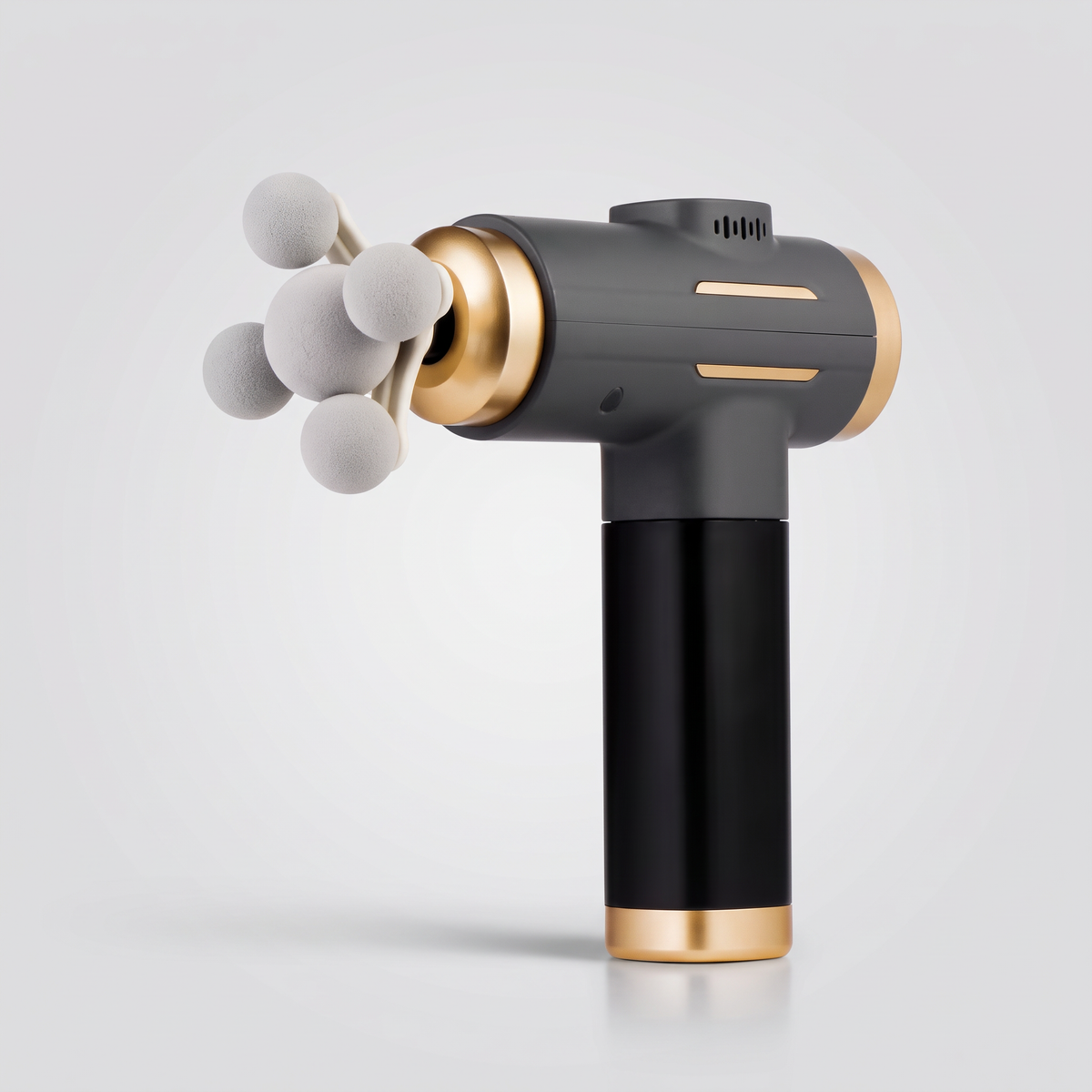 Pistolet de massage 11 têtes Le Sport Français noir et doré, packshot sur fond gris